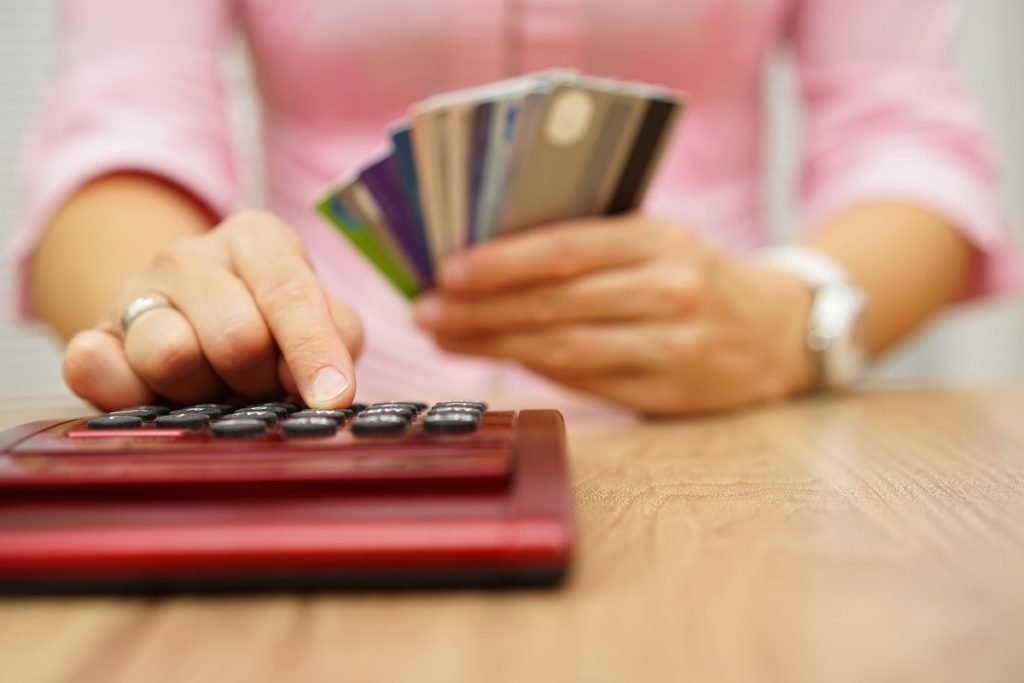 Woman computing her credit card debt